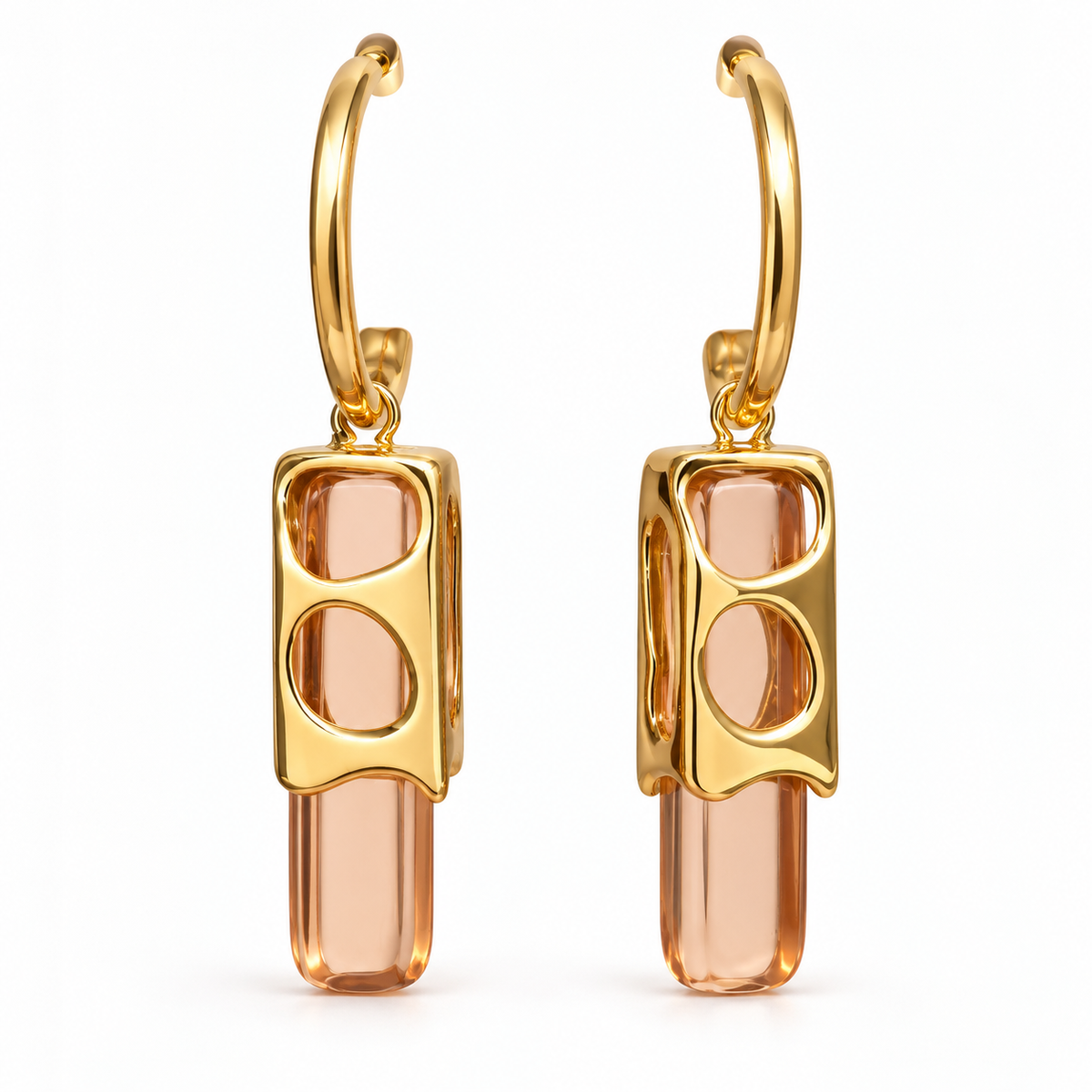 Modernist peach crystal prism drop earrings in gold cutout frame on pure white background