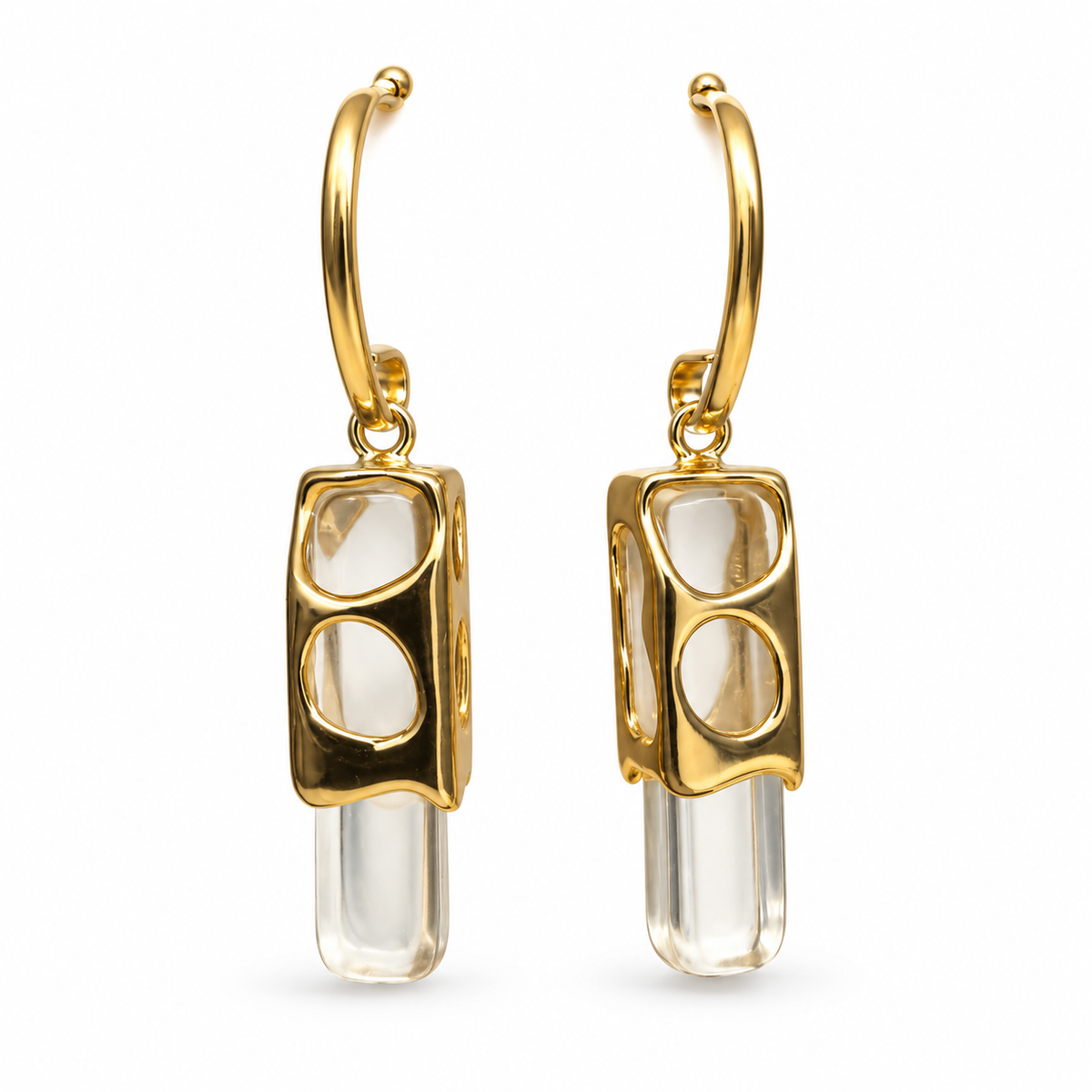 Modernist clear crystal prism drop earrings in gold cutout frame on pure white background