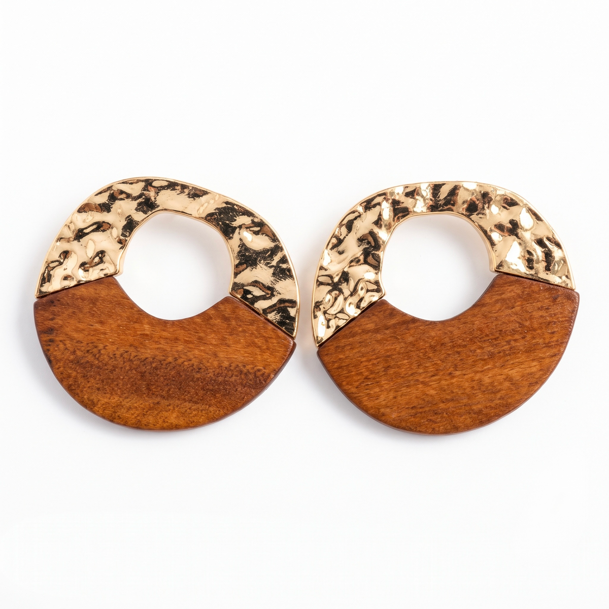 Hammered gold and natural teak wood circular statement earrings on pure white background